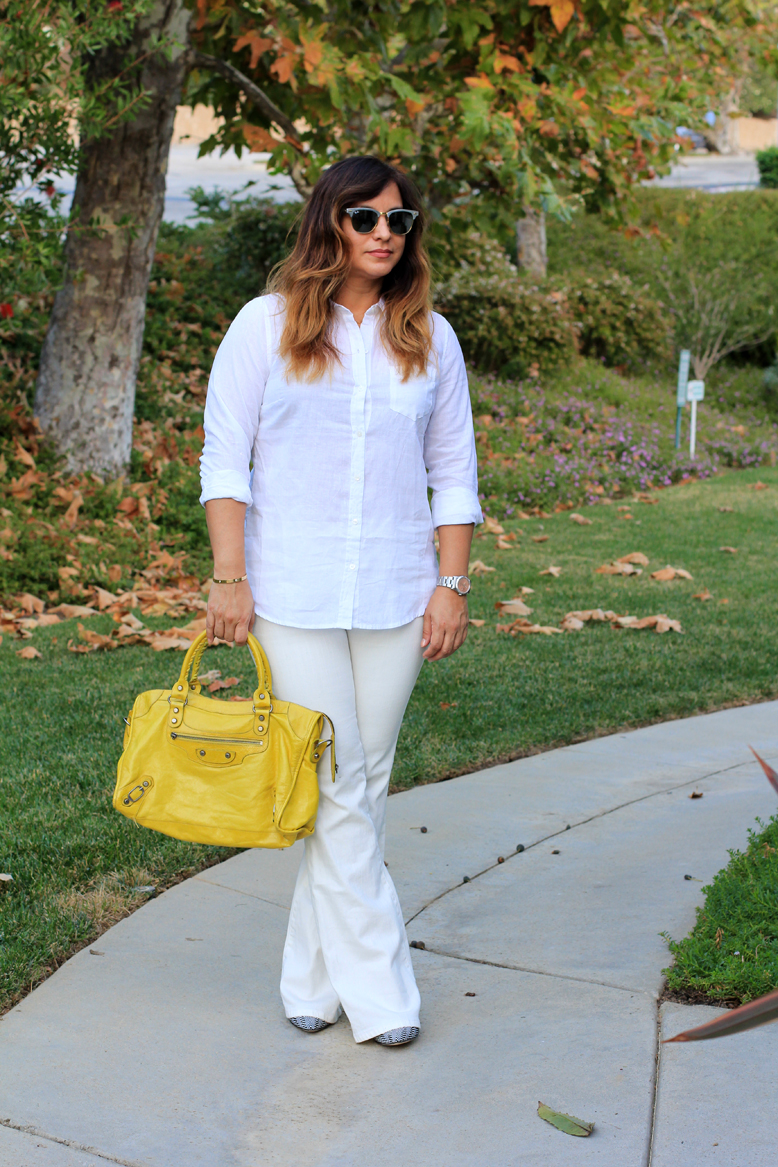 Rossana Vanoni Seasonless Outfit, J. Crew shirt, Revolve Clothing jeans, Carolinna Espinosa pumps, Baublebar earrings, Balenciaga bag, Ray Ban Clubmaster sunglasses